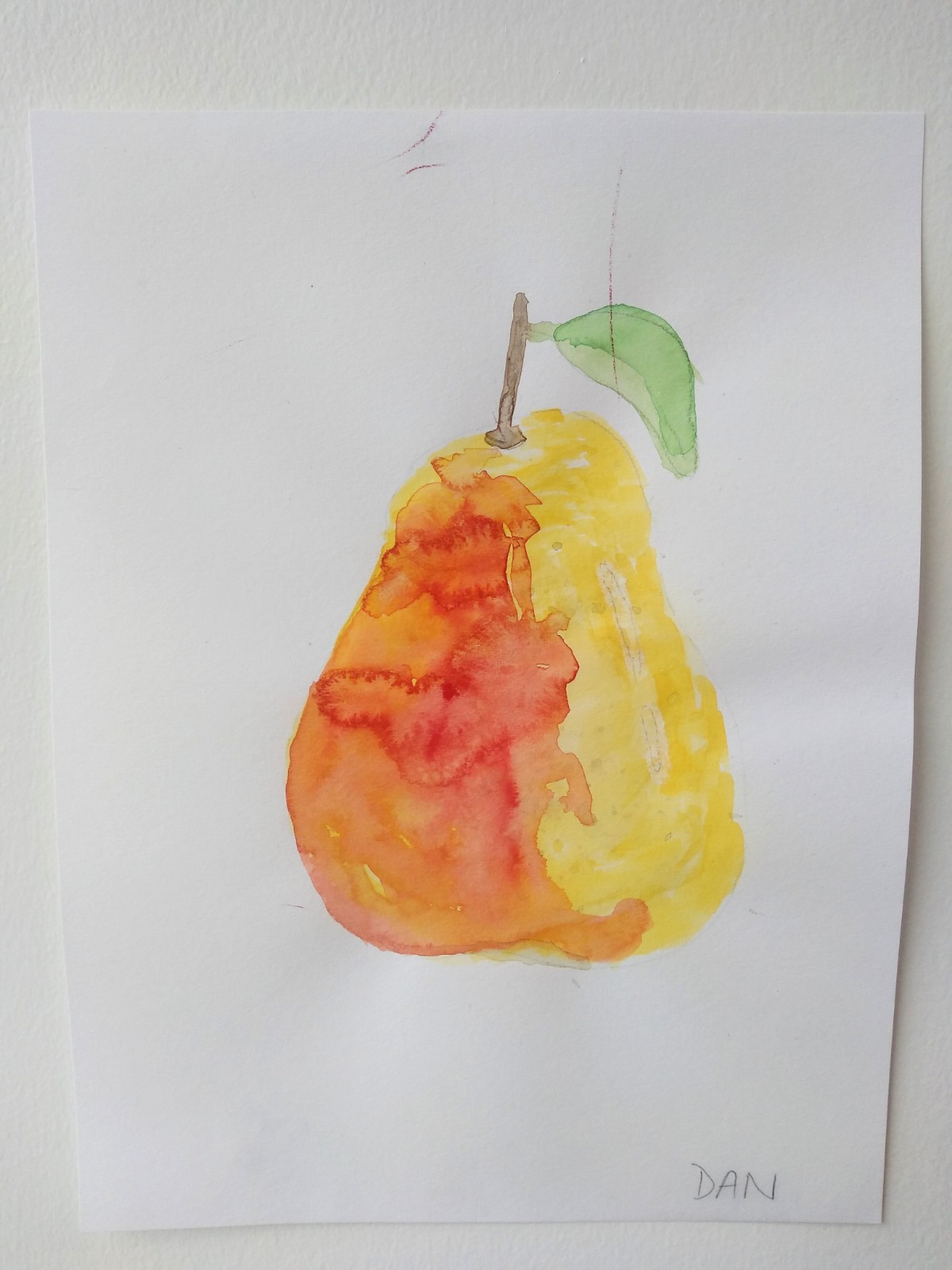 An orange and yellow pear.