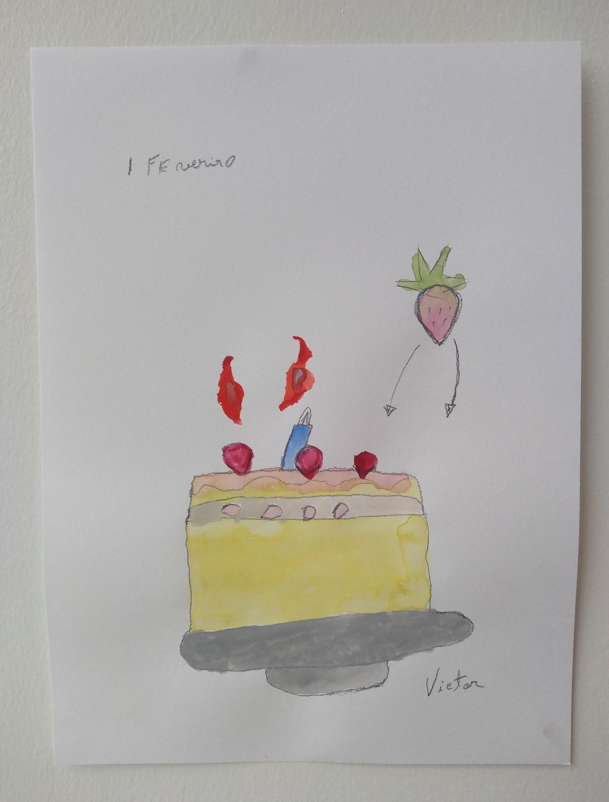 A yellow cake with read strawberries and lit candles on top.