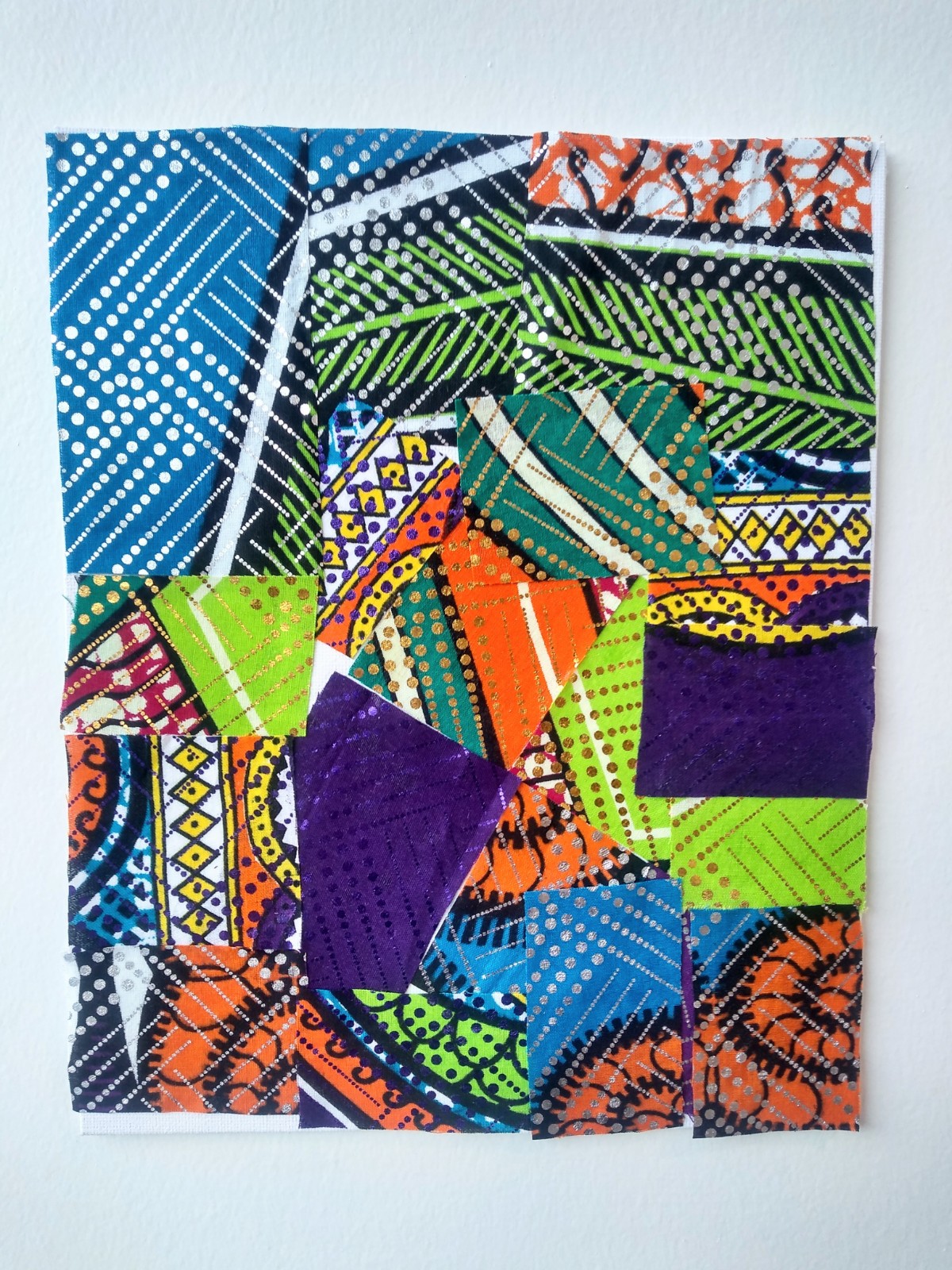 Collage of square shapes of African fabrics.
