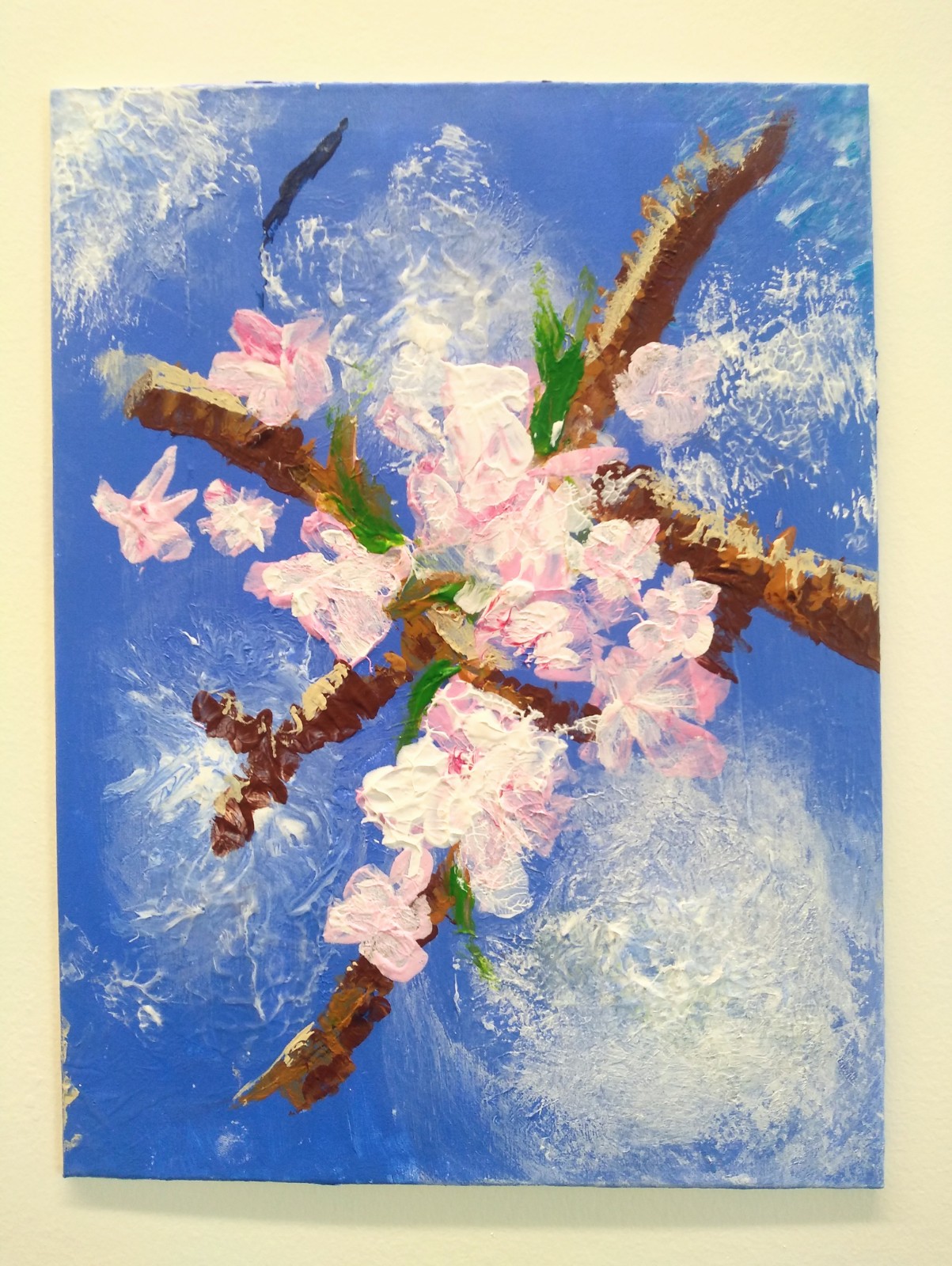 Textured cherry blossom on a branch with sky blue background.