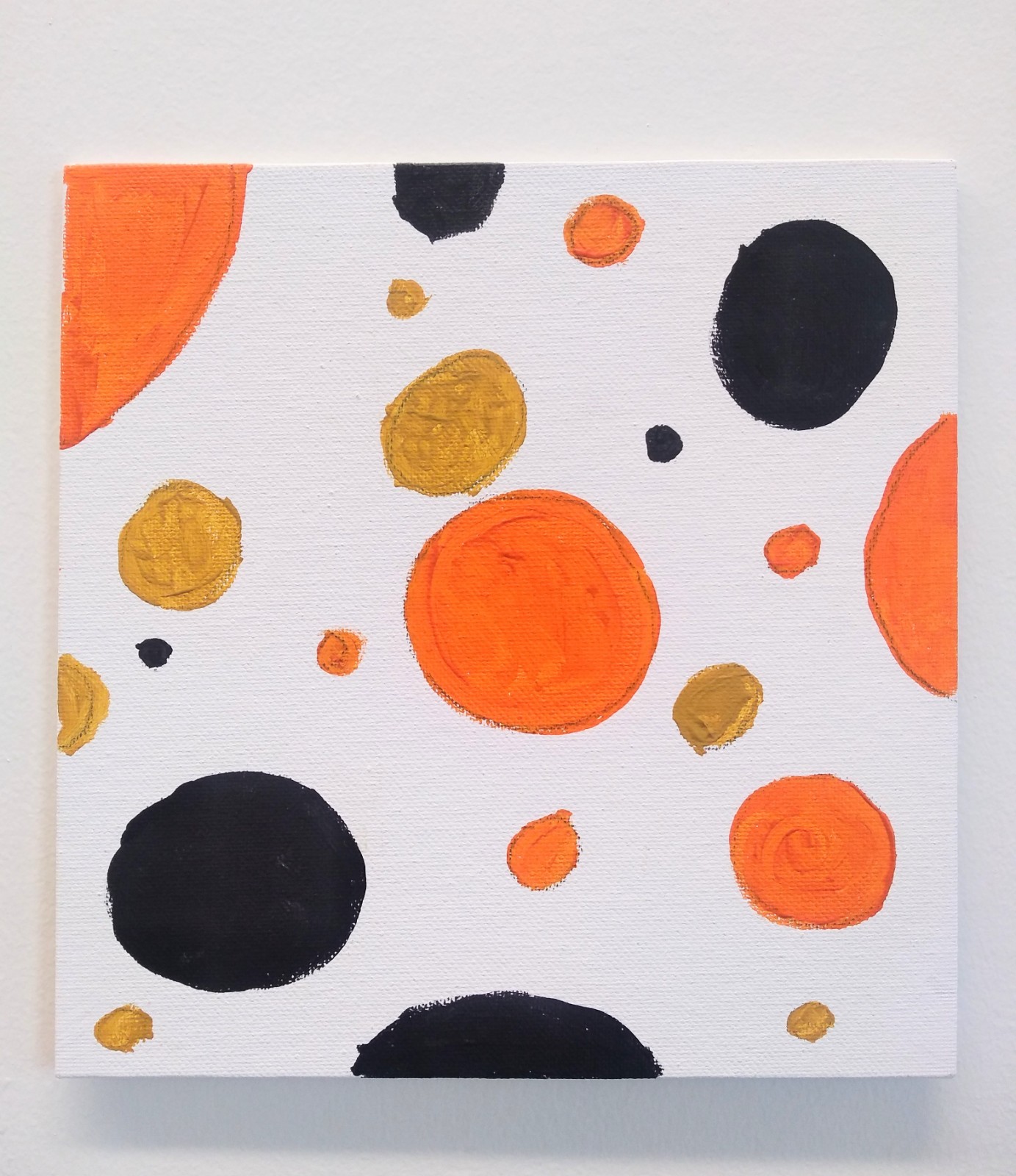 Black and orange circles spread out on white background.