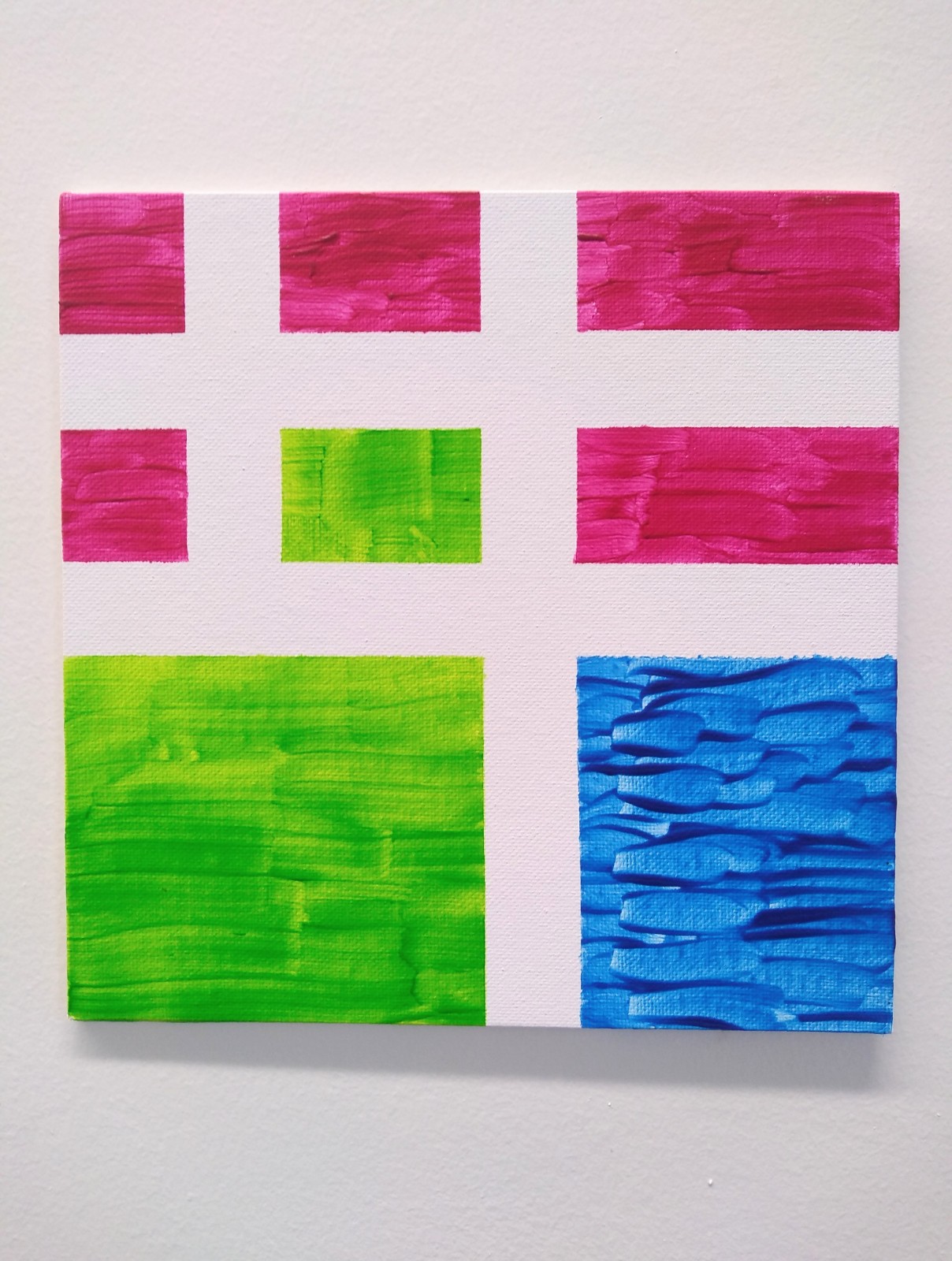 Pink and green rectangles above two large green and blue squares.