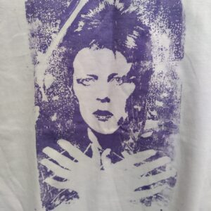 David Bowie portrait with arms crossed in purple screenprint on white shirt with the back left shoulder with text Cheap Trick reapeated twice.