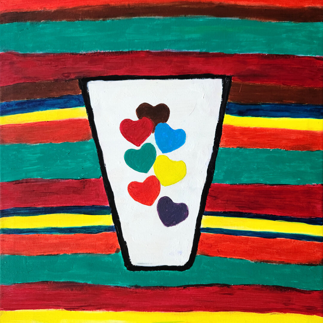 A painting of a white cup with hearts of various colours on a background of stripes in red, yellow, green and purple.