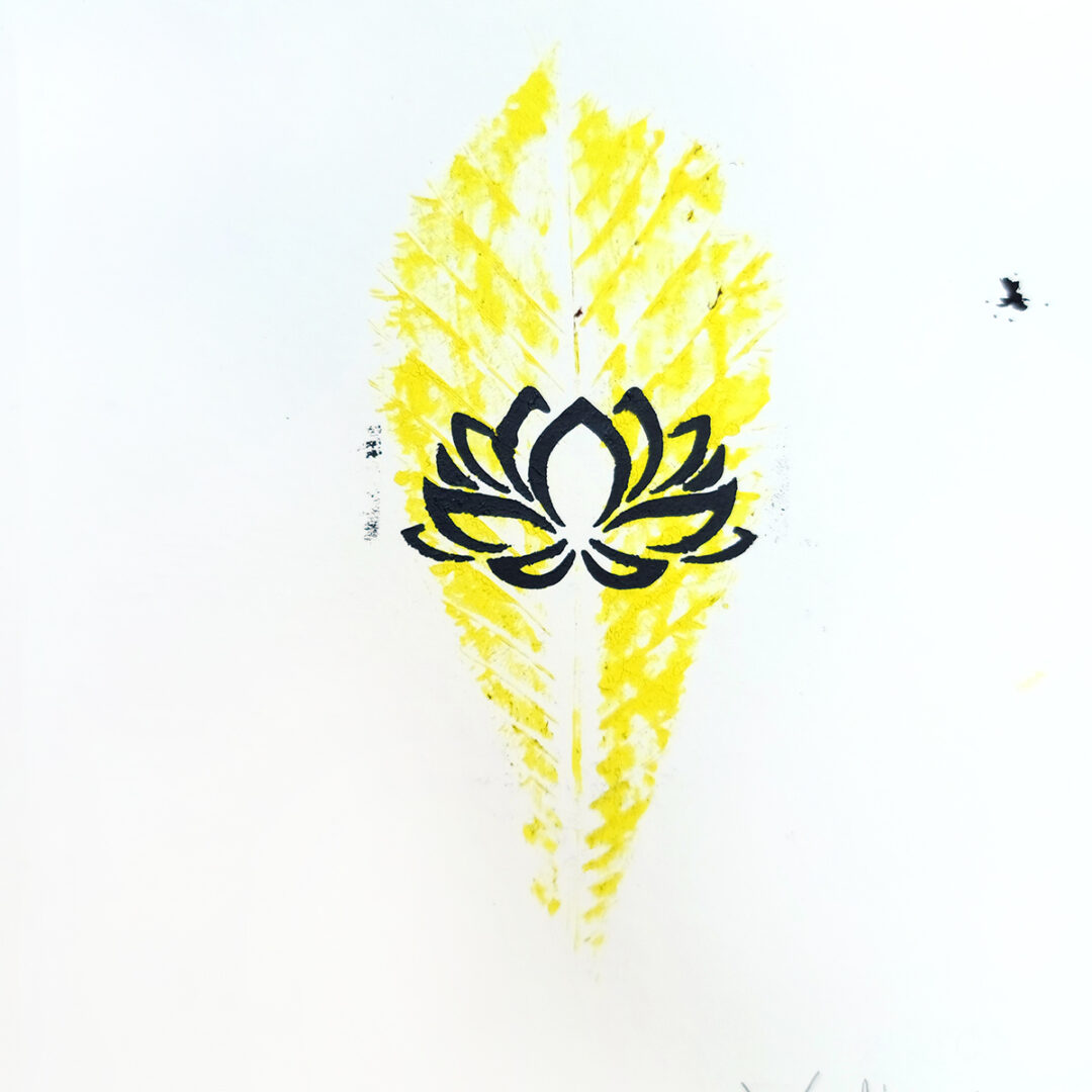 Yellow imprint of a leaf with a black lotus illustration in the center.