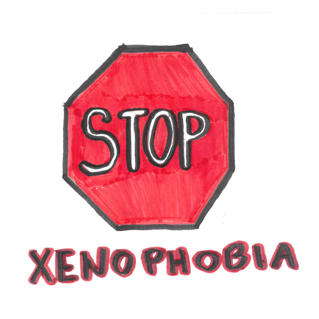 A large red stop sign above the word 'xenophobia' drawn in marker.