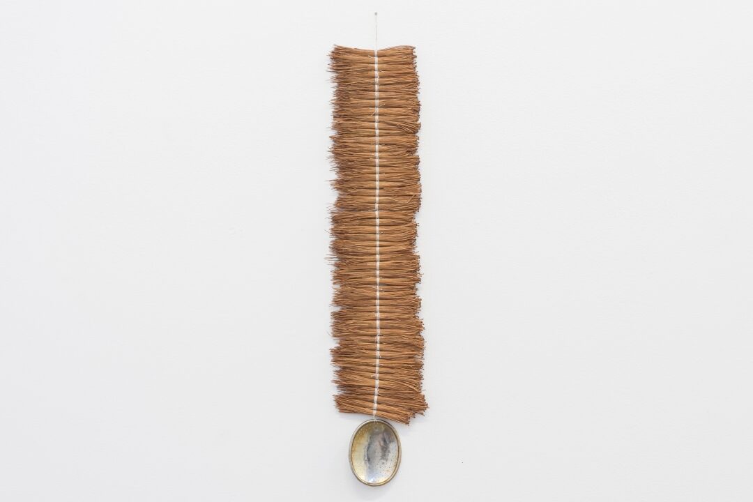 Leeay Aikawaya, Bindu, 2024. Pine needles, found object, cotton thread. Image courtesy of the artist.